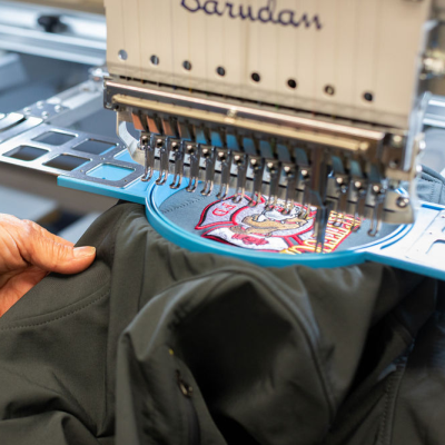 Mattituck Fire Department Maltese being embroidered on the machine.